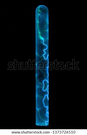 lightning and glowing electrical discharges in an inert gas flask on a black background Royalty-Free Stock Photo #1373726510