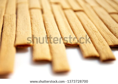 Dark and light biscuits, bamboo closeup, macro, food background