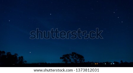 Panorama blue night sky milky way and star on dark background.Universe filled with stars, nebula and galaxy with noise and grain.Photo by long exposure and select white balance.Dark night sky. 