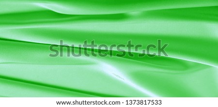 background texture, pattern. Green emerald silk fabric. This will add complexity to your design style. Its structural style characteristics are great for some of your decisions, wallpapers, posters.
