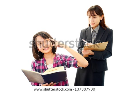 Teacher with girl studying.