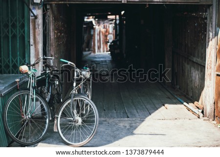 Ancient bikes parked in the old market at sunrise.