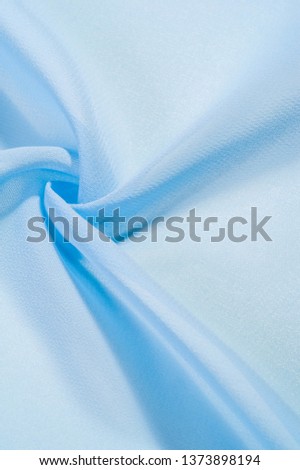 texture background pattern. blue silk fabric 