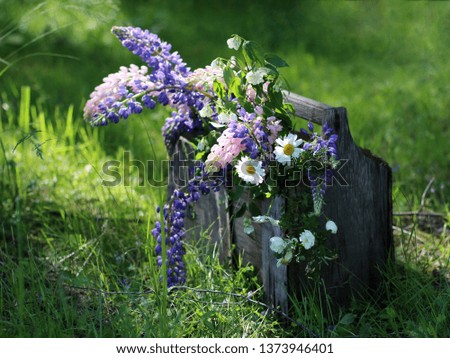 Bouquet of flowers in an old wooden box