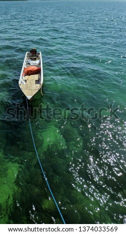 This is a picture taken from the boat. This picture shows the beauty of the sea on the island of East Borneo, Indonesia. The green and clear sea without plastic garbage.