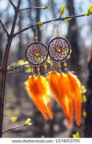 earrings of Dream catcher with feathers threads and beads rope hanging. Dreamcatcher handmade