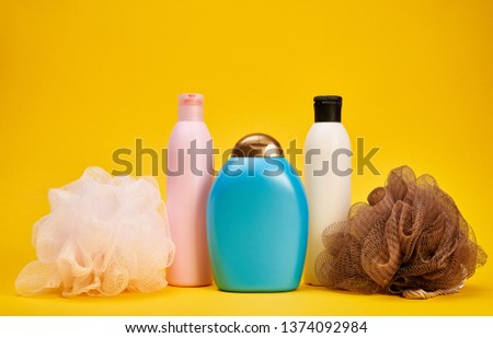 A set of bath cosmetics on yellow background