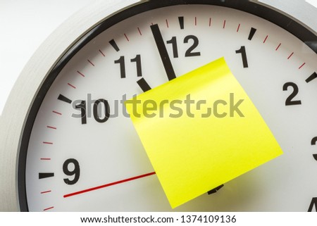 paper stick on clock for notice something with white background - Image