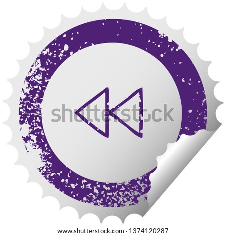 distressed circular peeling sticker symbol of a rewind button