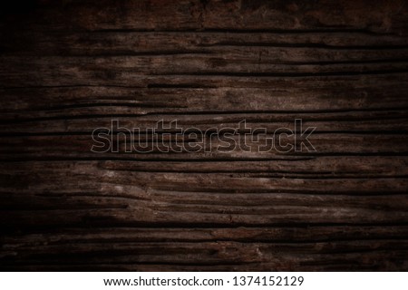 Texture and pattern of old dark brown wood.Old wood concept in vintage tone