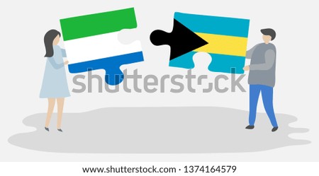 Couple holding two puzzles pieces with Sierra Leonean and Bahamian flags. Sierra Leone and Bahamas national symbols together.