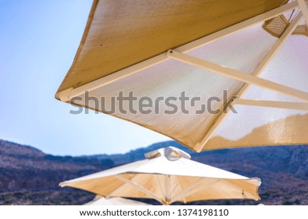 View at parasol and sunbeds at sea lagoon of Balos, Greece