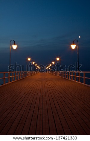 Sunrise on the pier at the seaside, Gdynia Orlowo, Poland. Long exposure photography