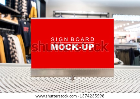 Mock up horizontal blank billboard with clipping path to show promotion or discount in accessory and clothing shop, red screen empty space for insert text or advertising in shopping mall