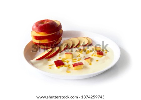 Greek Yogurt original flavor with fresh slice red Apple on the white plate,This is food for healthy and dietary food.It's perfect to be a vegetarian Isolated on white background