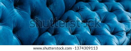 Velvet couch background texture with sunken buttons