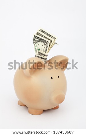 saving money, dollars in a piggy bank
