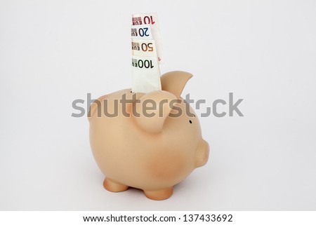 saving money, euro in a piggy bank