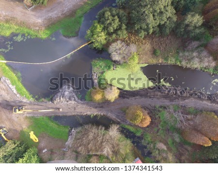 Drone aerial image of a polluted storm water retention pond