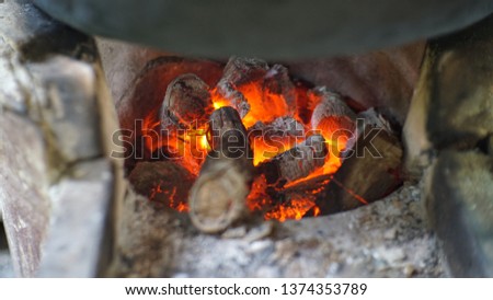 Charcoal stove with fire red light