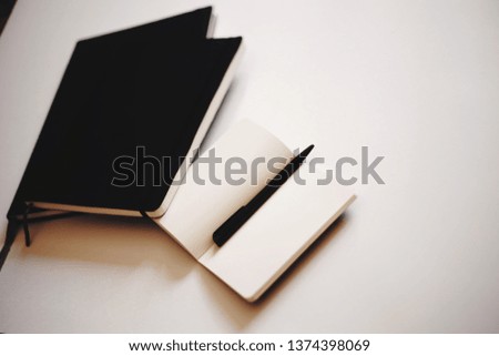 business notebook and pen