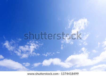 blue sky with white, soft clouds fresh .