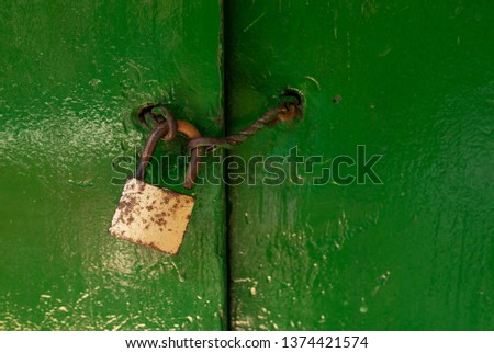 gold lock on green door