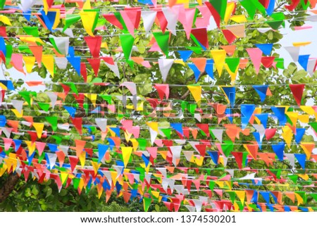 Pennant on green tree background.