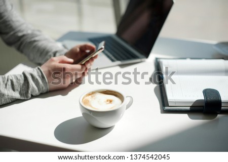 Lifestyle education student. Businessman work on laptop for project. Millennial at home office looking for job on notebook. Unrecognizable man using modern portable computer and phone.