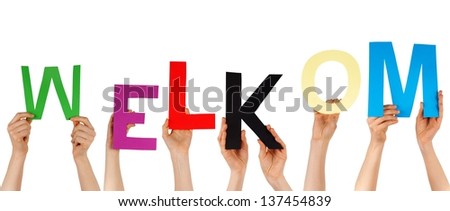 hands hold the dutch word WELKOM, which means, welcome, isolated