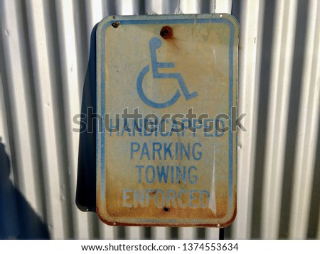 Faded and Weathered Handicapped Sign 
