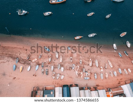 Boats on a beach in on moorings, drone photo.