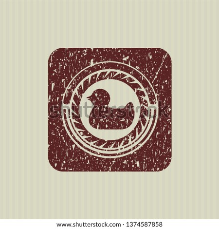 Red rubber duck icon inside distressed grunge style stamp