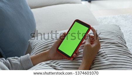 Woman hold with cellphone with chroma key 