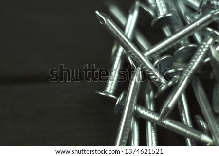 Nails on a black background close up                               