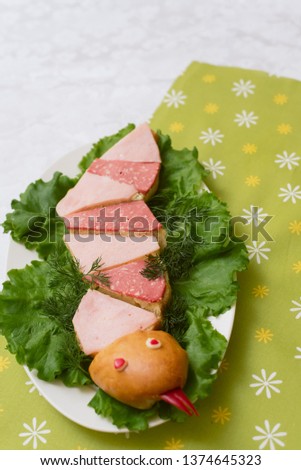 Children's food in a creative way. Snake-shaped sandwiches. Children's menu on a green background