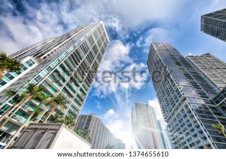 Upward street view of Downtown skyscrapers on a beautiful sunny day. Business and coroprate concept