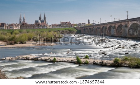 River named Allier and bridge of the city named Moulins in France Royalty-Free Stock Photo #1374657344