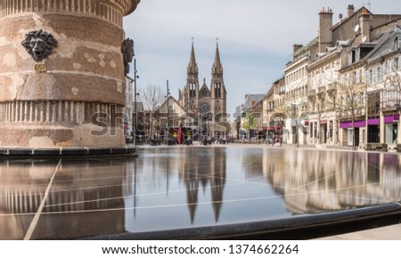 Reflect on a fountain of the city named Moulins in France Royalty-Free Stock Photo #1374662264