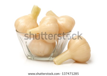 Sweet and sour garlic on white background