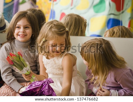 three little girls at birthday party having fun