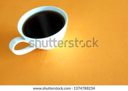 coffee cup orange color background. Top view. Flat lay style.

