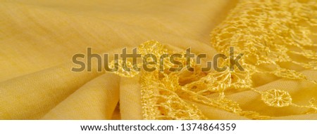 Texture, background, pattern, postcard, silk fabric, female yellow scarf with lace wrappers. Use these fancy images to create your print and digital materials.