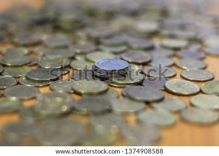 silver,gold coins on wooden table background