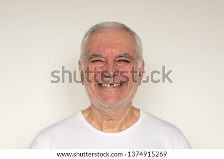 not in focus old man male senior face closeup missing tooth smile proper tooth overexposed happy friendly dental care doctor visit health problems  Royalty-Free Stock Photo #1374915269