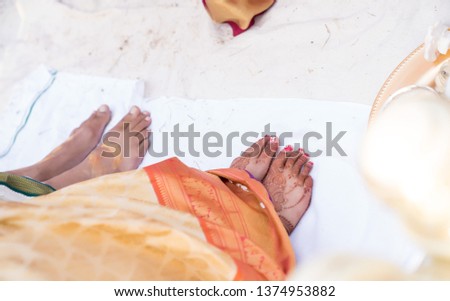 Indian Mehndi painting on the foot of bride.