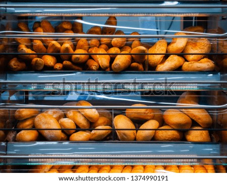 background - shelves in a grocery store with fresh bread of different varieties 