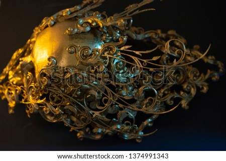 Gold, golden skull made with 3d printer and pieces by hand. Gothic piece of decoration for halloween or horror scenes