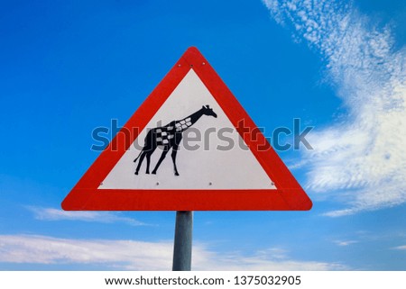 Giraffes crossing warning road sign used in Africa