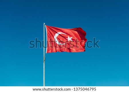 Turkish national flag hang on a pole in open air.